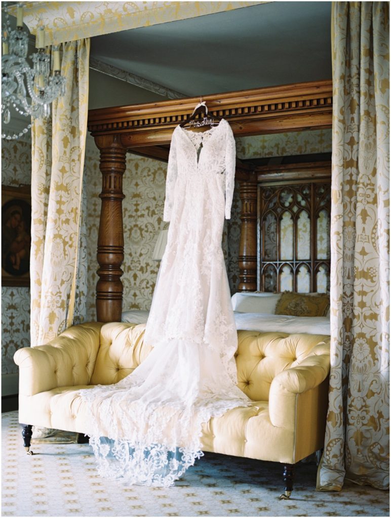 bride's wedding dress hanging in her bridal suite